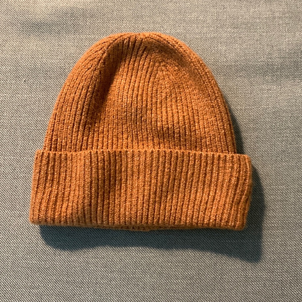 Orange/light brown beanie, barely worn.
